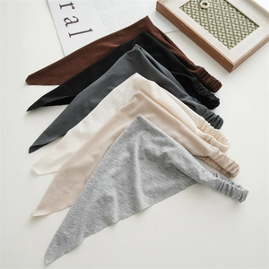 Detail of bohemian cotton triangle hair scarves in six neutral colors with elastic bands