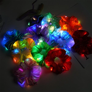 Colorful LED glowing satin hair scrunchies in vibrant neon colors for night party and festivals