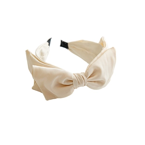 Elegant wide cream satin headband with a large decorative bow for women