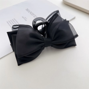 Large black double-sided bow hair claw clip with satin and organza fabric layers