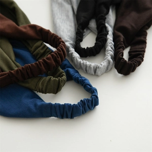 Detailed close-up of elastic cotton headbands showing knit texture and rich solid colors