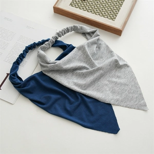 Close-up of knit cotton triangle bandanas in grey and navy with elastic back detail
