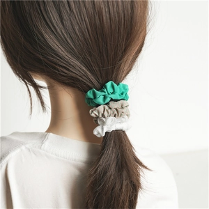 Three-piece Korean hair scrunchies set in green, plaid, and white for ponytail styling