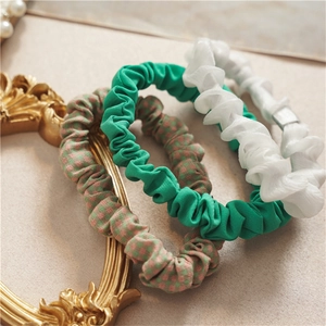 Three-piece Korean style hair scrunchies set featuring pastel pink and green grid patterns