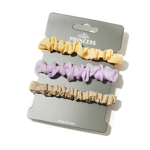 Three-piece hair scrunchie set with yellow, purple organza, and plaid fabric styles