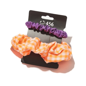 Two-piece hair scrunchie set in purple solid and orange plaid on black card