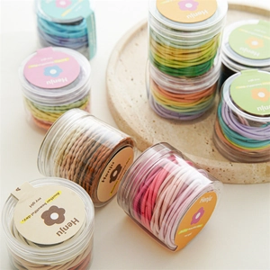 Set di elastici per capelli colorati in vasetti con trama a maglia color macaron