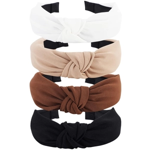 Vertical stack of four knotted fabric headbands in white, beige, brown, and black colors