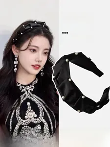 Detail of black pleated headband with pearl accents on Asian model and close-up product view