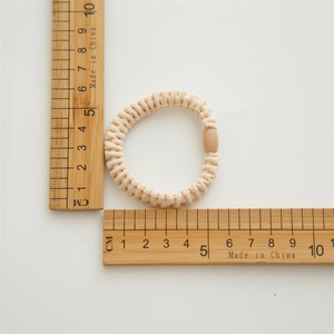 Élastique cheveux spirale beige avec raccord ovale, dimension environ 5cm de diamètre