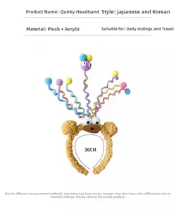 Detail showing plush funny monster headband with colorful spring antennas and eyes