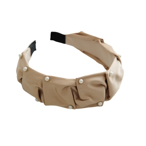 Elegant beige pleated pearl headband featuring stylish matte fabric for a high-top look