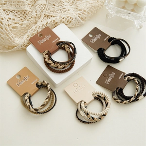 Close-up of high-elasticity braided hair ties set in coffee and leopard print tones