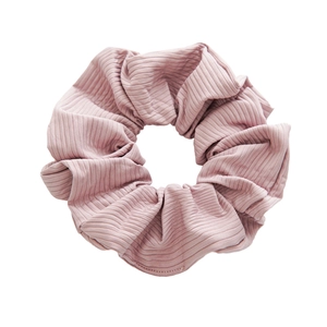 Elegant dusty pink ribbed fabric scrunchie with soft texture and high elastic stretch