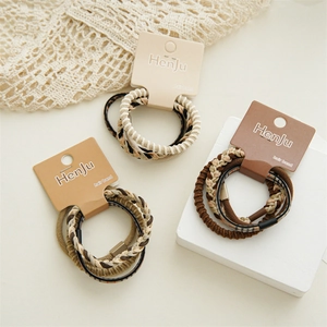 Detail view of coffee-themed braided hair bands with leopard patterns and soft textures