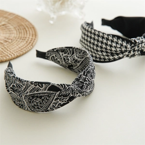 Detail of knot headband set featuring houndstooth and paisley fabric textures
