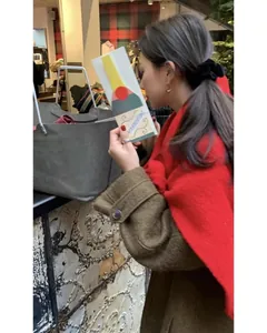 Winter elegant grey felt tote bag shown with red scarf and brown coat in lifestyle scene