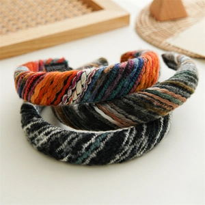 Detailed texture of thick knitted headbands in assorted colors and warm wool fabric