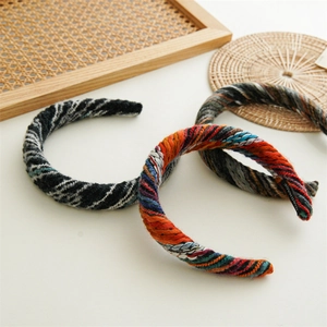 Three-piece set of thick handmade knitted headbands in colorful vintage wool styles