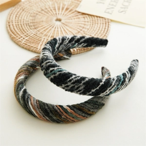 Close-up of winter knitted headbands set showing detailed cable knit texture and patterns