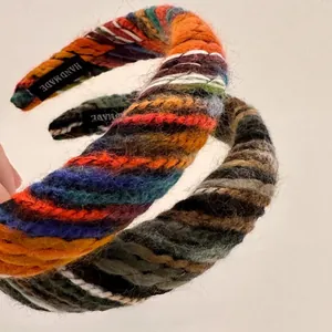 Detail of colorful woven wool headband with handmade label in bohemian knit style