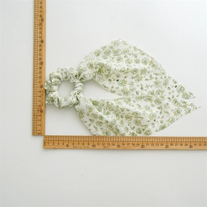 Floral print long ribbon scrunchie in green and pink, measuring 33cm in length