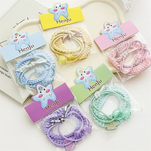 Three-piece candy-colored elastic hair ties with floral charms and bow decorations