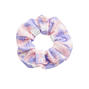 Pink and purple tie-dye knit scrunchie with ribbed texture on white background