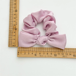 Elegant lavender satin scrunchie with large bow knot, 13cm length on white background