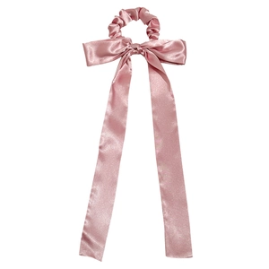 Elegant long ribbon bow scrunchie in soft pink satin fabric for stylish ponytail holders