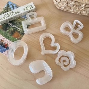 Minimalist cream white resin hair claw clips set with geometric and heart shapes