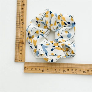 Floral print oversized fabric scrunchie with yellow and blue flowers, 11cm diameter