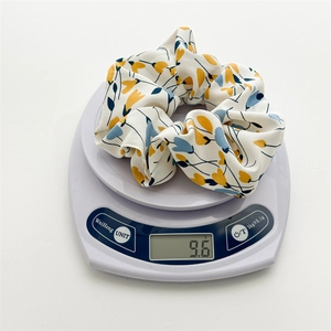 Floral print large scrunchie in white fabric with yellow and blue flowers weighing 9.6g