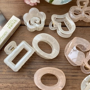 Elegant geometric hair claw clips in cream white and light pink resin for women