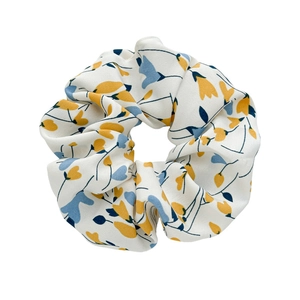 Floral print cream scrunchie with yellow buds and blue leaves in high-quality chiffon fabric