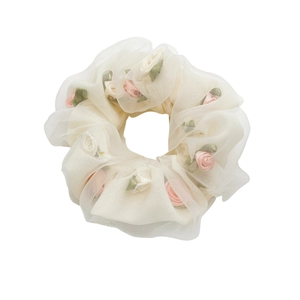 Elegant white mesh scrunchie featuring delicate pink fabric roses and green ribbon leaves
