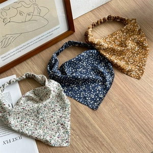 Set of three floral elastic headbands in yellow, navy, and beige for women