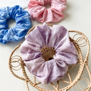Fashionable tie-dye and solid color cotton scrunchies set in lavender, pink, and blue tones