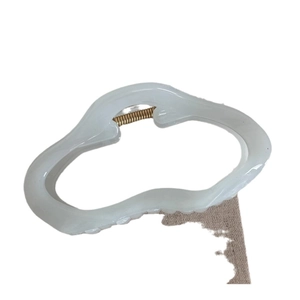 Minimalist cream white wavy shark hair claw clip for women with matte texture and gold spring