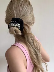 Detail of nautical style silk scrunchie with stripes and Change text on high bun