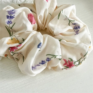Vintage floral fabric scrunchie with colorful lavender and rose print on ivory cotton