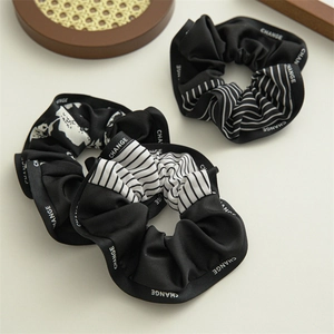 Navy style satin scrunchies set in black with white stripes and floral patterns
