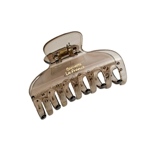 Brown translucent resin hair claw clip with golden Barrette La France lettering
