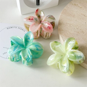 Floral hair claw clips with marble texture in pink, blue and green colors