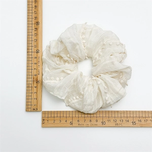 Elegant cream white oversized fabric scrunchie with delicate embroidery and 12cm diameter