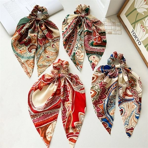 Set of four vintage paisley patterned silk scrunchies with elegant long ponytail ribbons
