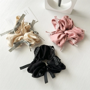 Three-piece set of satin scrunchies in white, pink and black with polka dot bows