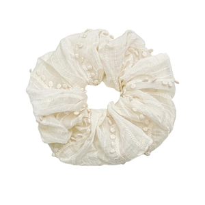 Elegant cream white fabric scrunchie with 3D dot embroidery and wavy texture