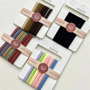 Detailed close-up of high-elasticity fabric hair ties in diverse colorful sets and textures