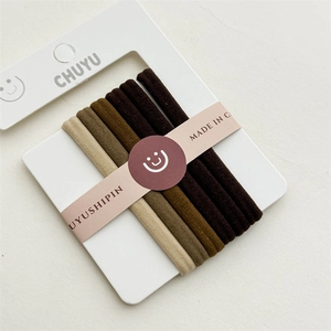 Detail of high-elastic braided hair ties in five gradient coffee shades on display card